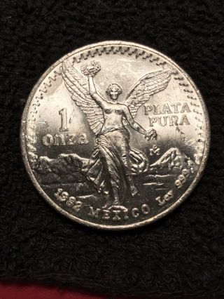 1982,  1983 Mexico Silver 1 Onza Libertad.  999 BU Lettered Edge 3