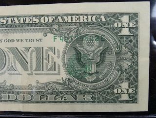1995 MIS STAMPED $1 FEDERAL RESERVE ERROR NOTE SERIAL NUMBERS ON THE REVERSE 10