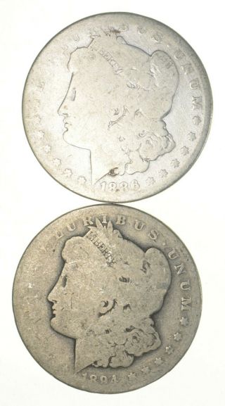 (2) Bullion Grade Morgan Silver Dollars 1894 - O & 1886 90 Silver $1 Coins 814