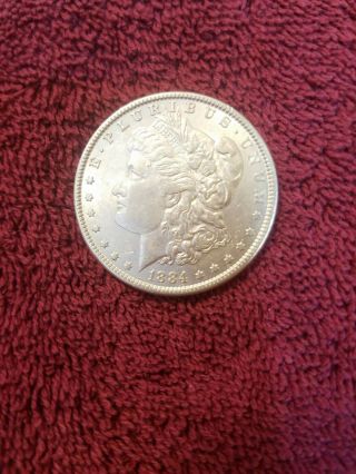 1884 - P Morgan Silver Dollar In Au/bu.  Coin.  560