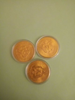 3 coins.  50 Pesos 1947 Mexican Gold Coin 2