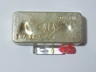 10.  01 Ounce Hand Poured Silver Bar Plus Natural Gold Nugget
