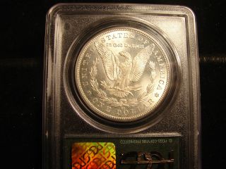 1883 - CC Morgan Silver Dollar,  Graded by PCGS MS65,  In OGH,  as pictured. 2