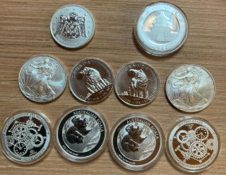 10 - 1oz Silver Worlds Best Coins,  Can. ,  Austr. ,  China,  Us,  100 Trillion Zimbabwe