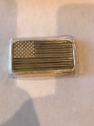 10 Ounces Of 999 Pure Silver Bar.  United States Flag.  In Plastic.