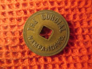 Nampa,  Idaho Brass Trade Token - Square Punched Hole