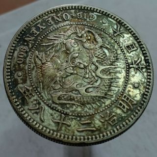 Japan 1 yen.  900 silver coin 1895 meiji 28 sharp details toned 6