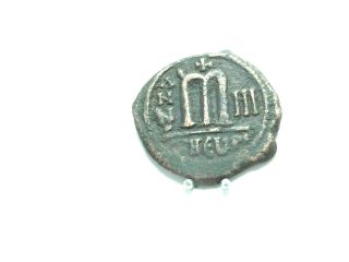 Byzantine coin PHOCAS and LEONTIA,  AD 602 - 610.  AE Folli,  27mm;10.  9 g.  Theopolis.  VF 2