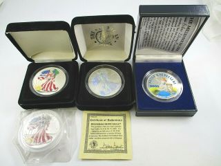 2 Colorized & 1 Hologram U.  S.  Silver Eagles Coins.  999 Silver,  $20 Rep Liberia