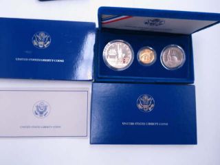 UNITED STATES LIBERTY COINS 1986 3 CoinProof Set w/Certs.  24oz gold.  77oz Silver 11