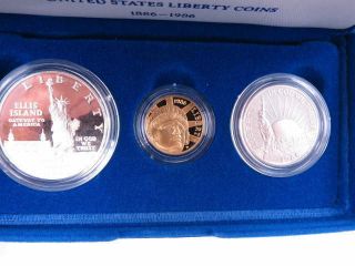 UNITED STATES LIBERTY COINS 1986 3 CoinProof Set w/Certs.  24oz gold.  77oz Silver 2