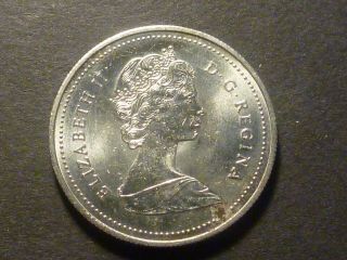 1986 BU nickel 50 - cent,  struck through grease,  with grease retained 3