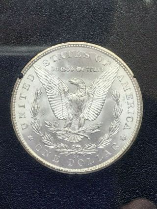 1883 CC Uncirculated Morgan Silver Dollar with and packaging.  Toning. 2