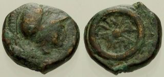 060.  Greek Bronze Coin.  Thrace.  Ae - 10.  Helmet / Wheel.  Fine
