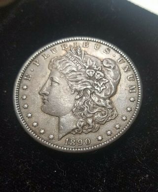 1890 - CC Carson City Silver Morgan Dollar toned AU.  Latent lustre 3