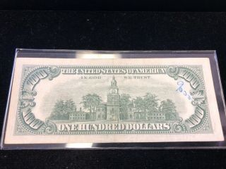 Series 1966 A $100 United States Red Seal Note au writing on face 2