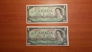 (2) 1967 Bank Of Canada $1 - - 1 With Serial (cir) And 1 Without Serial (unc)