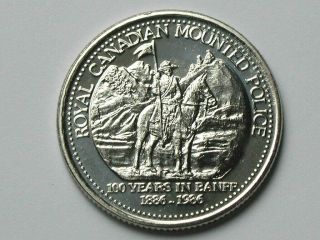 Banff Ab Canada 1986 Trade Dollar Token With Rcmp Horse/rider & Castle Mountain