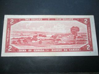 L - 1954 BANK OF CANADA CANADIAN $2.  00 BILL TWO DOLLAR CIRCULATED ORANGE 2