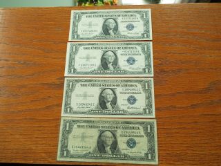 Four - 1 Dollar Silver Certificates 2 - 1935e 1 - 1935f 1 - 1957a