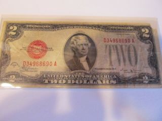1928 - E $2 Two Dollar Bill Red Seal Note Ave.  Circulated