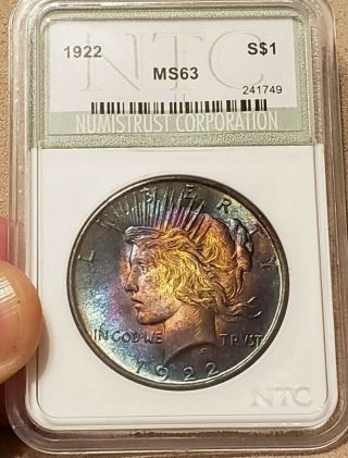 1922 Silver Peace Dollar,  unbelievable RAINBOW TONED coin in slab 3