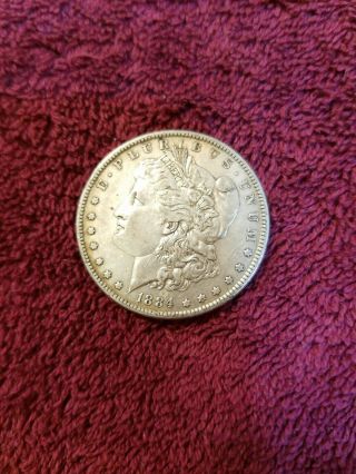 1884 - P Morgan Silver Dollar In Xf/au.  598