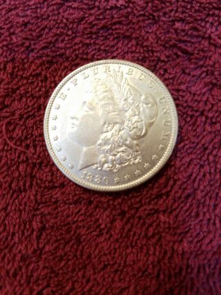 1880 - O Morgan silver dollar in AU.  505 3