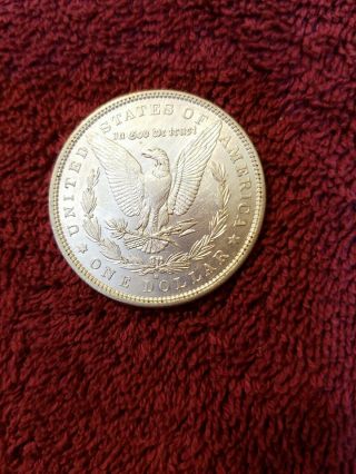 1880 - O Morgan silver dollar in AU.  505 6