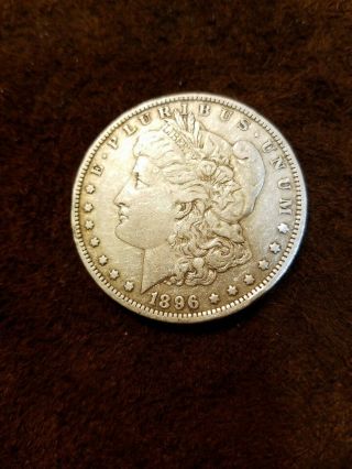 1896 - O Morgan Silver Dollar.  Au.  Tough Grade M58