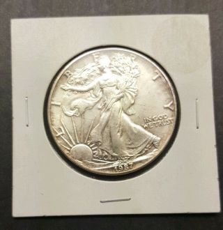 Better Date 1987 American Silver Eagle 1 Troy Oz.  999 Some Toning