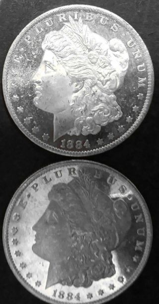 1884 - O Morgan Silver Dollars.  Uncirculated.  Frosty Bust W/mirror.