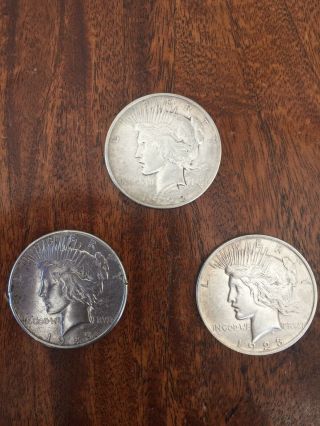Three (3) Early - 1920’s (1922,  1923,  1923) Silver “peace” Dollars.