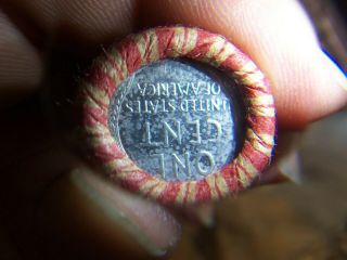 WHEAT PENNY ROLL WITH A UNKNOWN STEEL WHEAT PENNY SHOWING 2