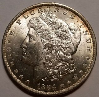 1884 - O Morgan Dollar 1.  U Grade.  Starts At 99 Cents