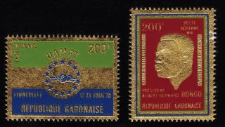 Gabon C95 And C101 Hinged Two Stamps Embossed On Gold Foil