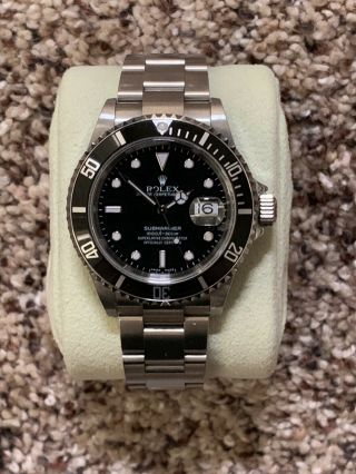 Rare “flat S” 2006 Rolex Submariner Date 16610 T Stainless No Holes Watch.