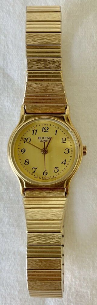 Vintage Bulova Ladies Watch,  Gold Tone With Stretch Band,  Battery.