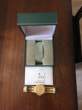 Pre - owned Gucci men ' s watch gold 3300.  2.  m with gold plated belt and dial. 5