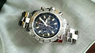 BREITLING AVENGER BLACK MEN ' S 48.  4M WIDE WITH DIAMONDS,  PAPERS 4