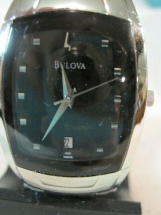 27 - Bulova Quartz Stainless Steel/date Watch C876727 In Plastic Holder/broken.