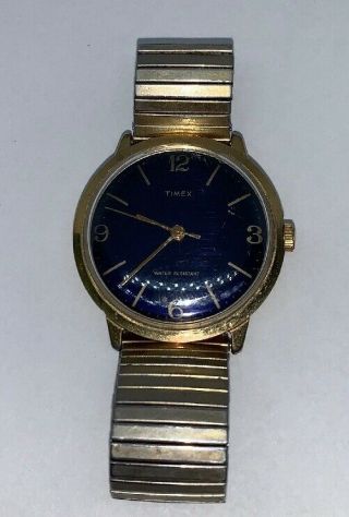 Vintage Timex Wind Up Blue Face Base Metal Gold Tone Stretch Band