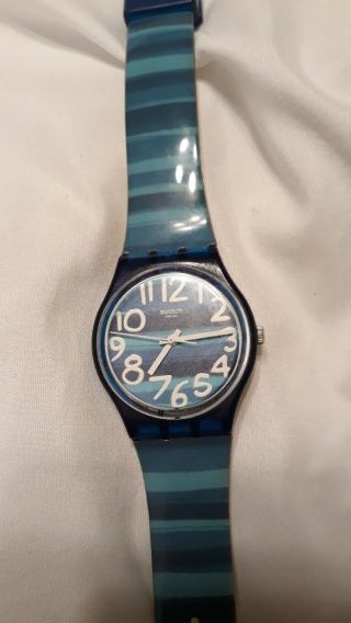 Multi colored Blue Swatch Watch.  Women ' s with second hand and water resistant 3