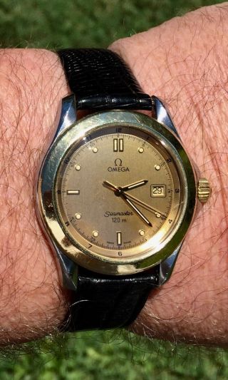 Men’s 1990’s Omega Seamaster 2411.  10 120m 18k Gold & Steel & Champagne Watch