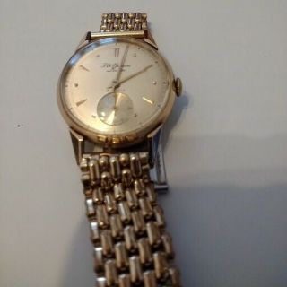 mens 1955 9ct gold J.  W Benson wrist watch,  in. 11