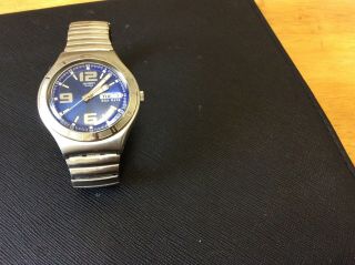 Irony Swatch Watch With Large Blue Face & Silver Metal Stretch Strap