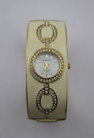 Bebe Ivory Enamel Gold Tone Rhinestone Crystal Hinged Bangle Bracelet Watch