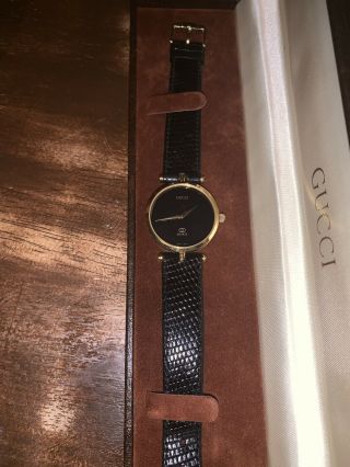 Gucci Quartz Swiss Made Ladies Black And Gold Watch