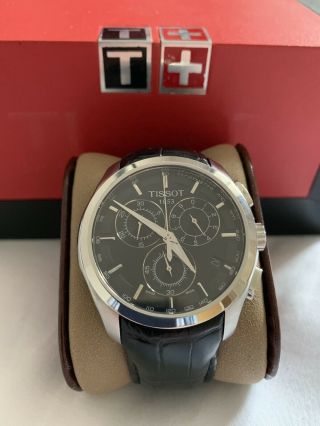 Tissot Chronograph Watch,  Chrome With A Black Face.  Leather Strap