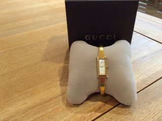 Ladies Gucci 1500l Stainless Steel Bangle Watch With Mother Of Pearl Face
